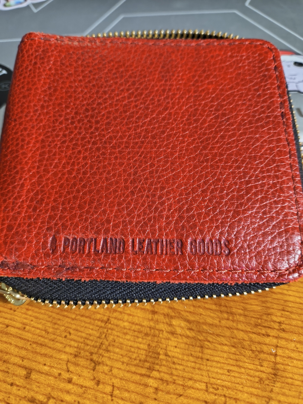 Portland Leather Goods Chili Red Small Zipper Bifold Wallet.
